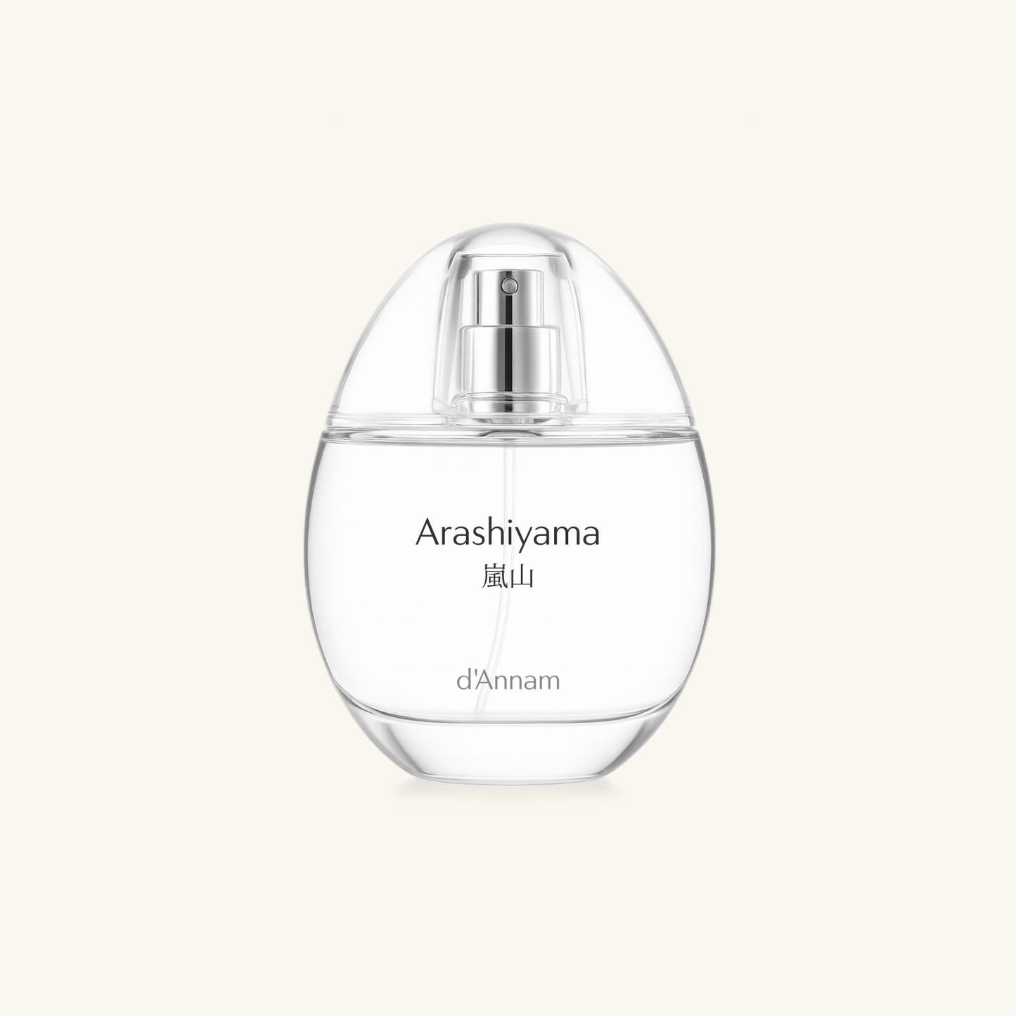 Clear perfume bottle with silver cap labeled 'Arashiyama' on a light beige background