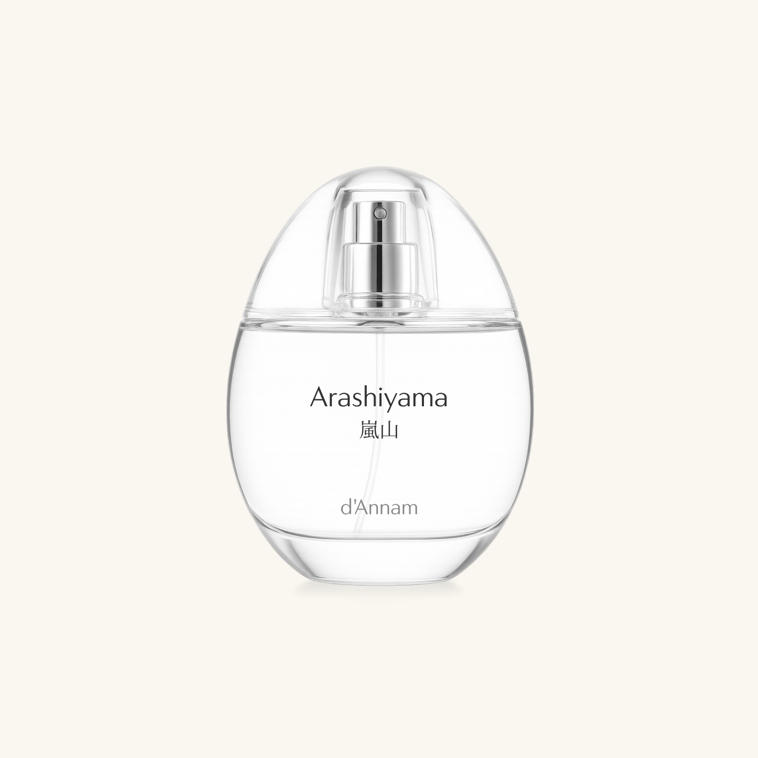 Clear perfume bottle with silver cap labeled 'Arashiyama' on a light beige background