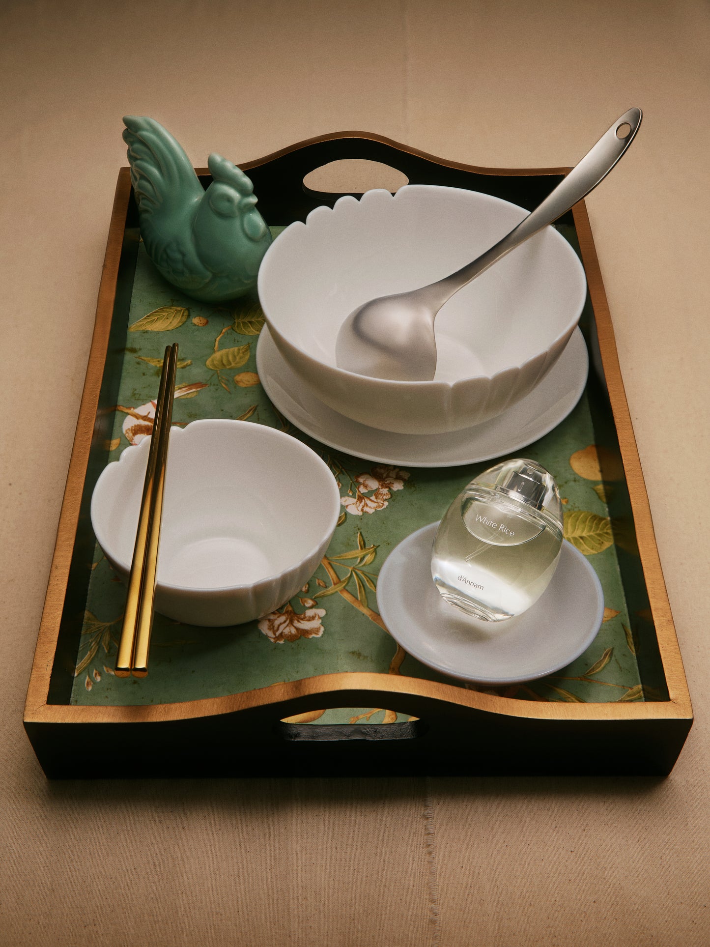 Tray with bowls, chopsticks, and a spoon on a decorative tray