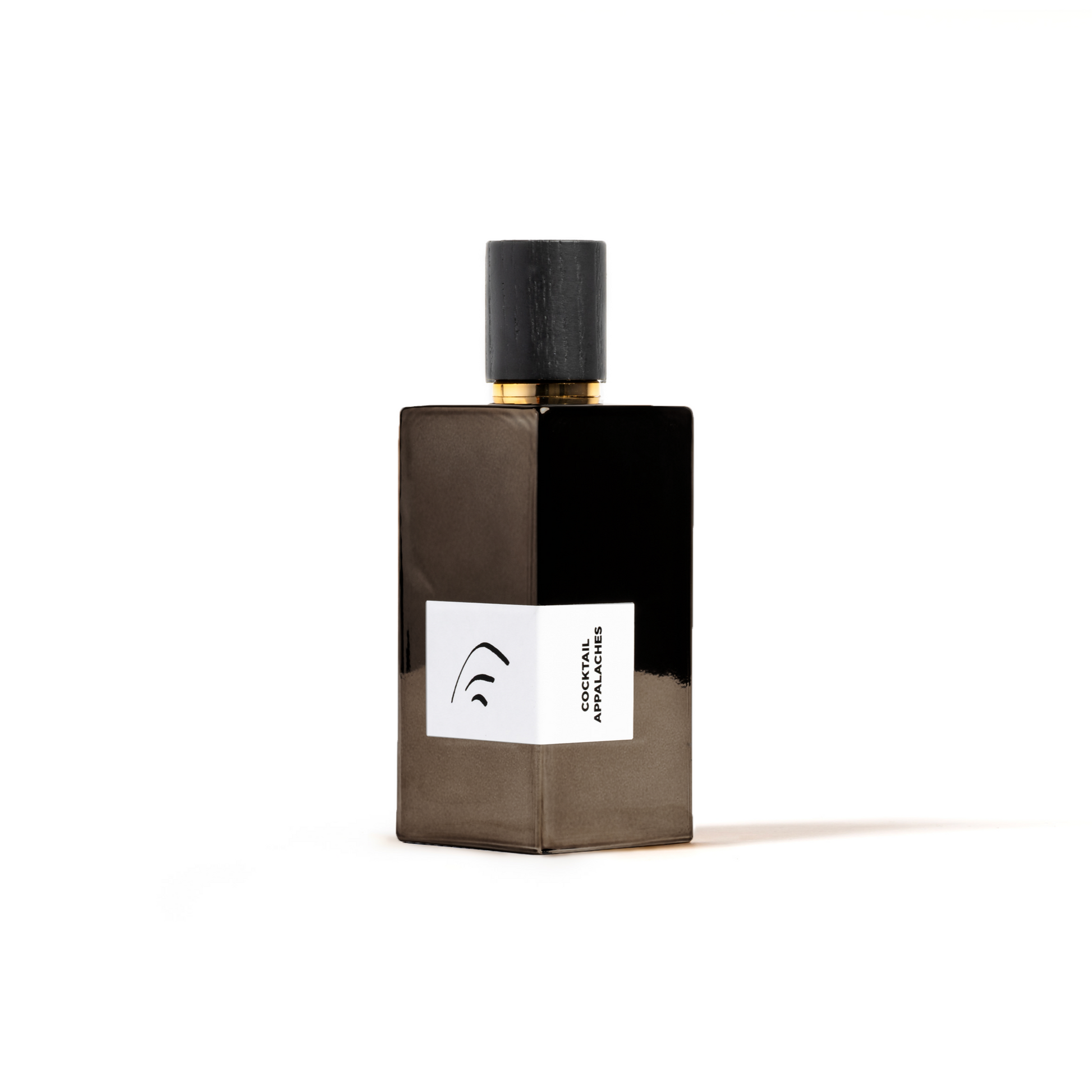 Black perfume bottle with a white label on a white background
