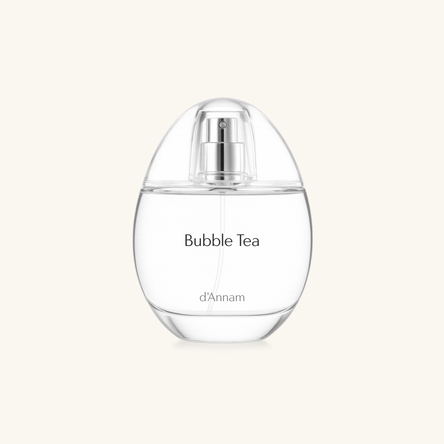 A clear glass perfume bottle labeled 'Bubble Tea' by d'Annam, featuring a silver spray mechanism and a rounded, egg-shaped silhouette, set against a solid off-white background.
