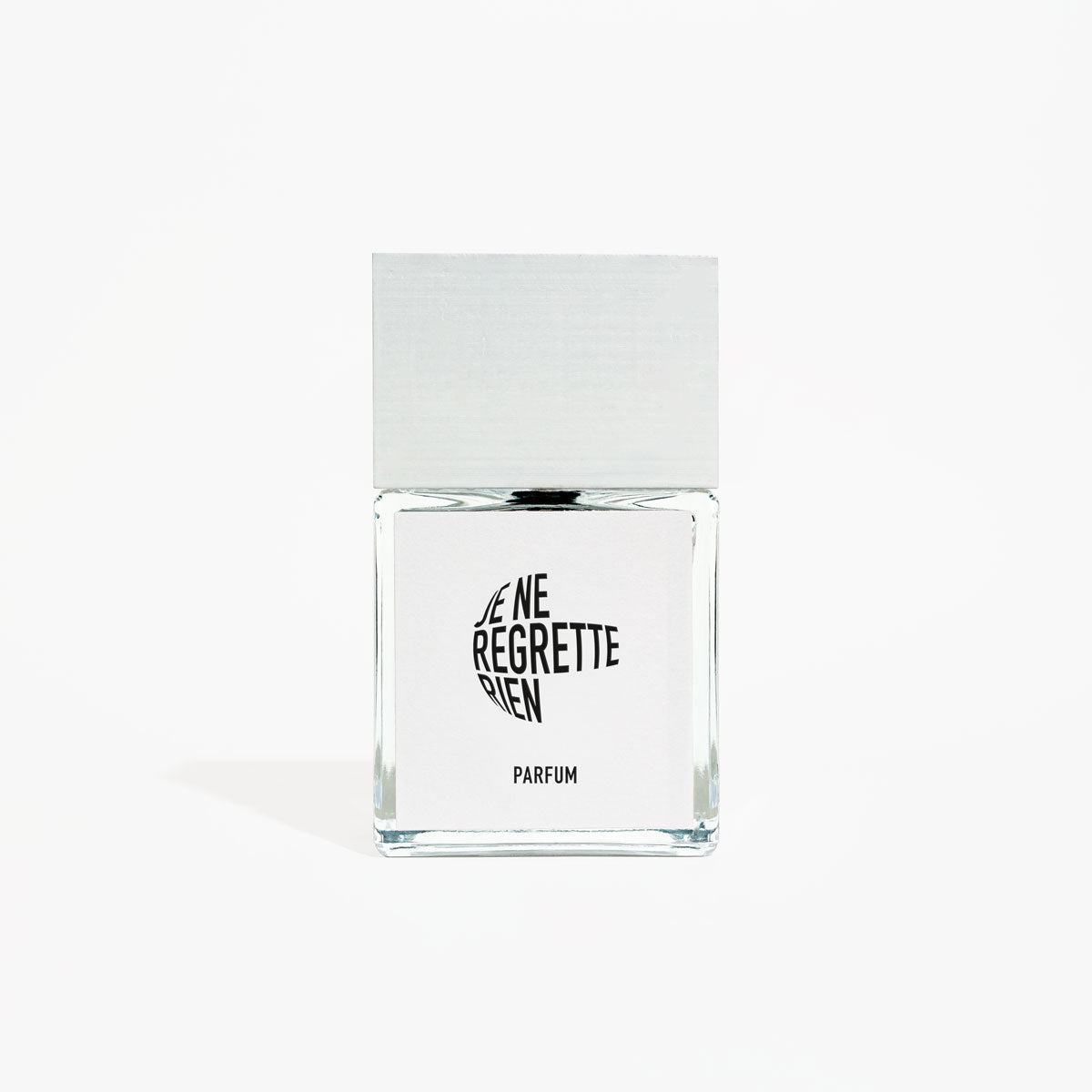Clear glass perfume bottle with black text on a white background