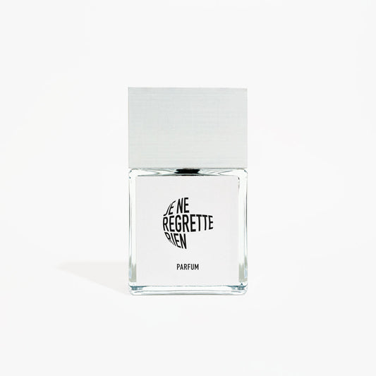 Clear glass perfume bottle with black text on a white background
