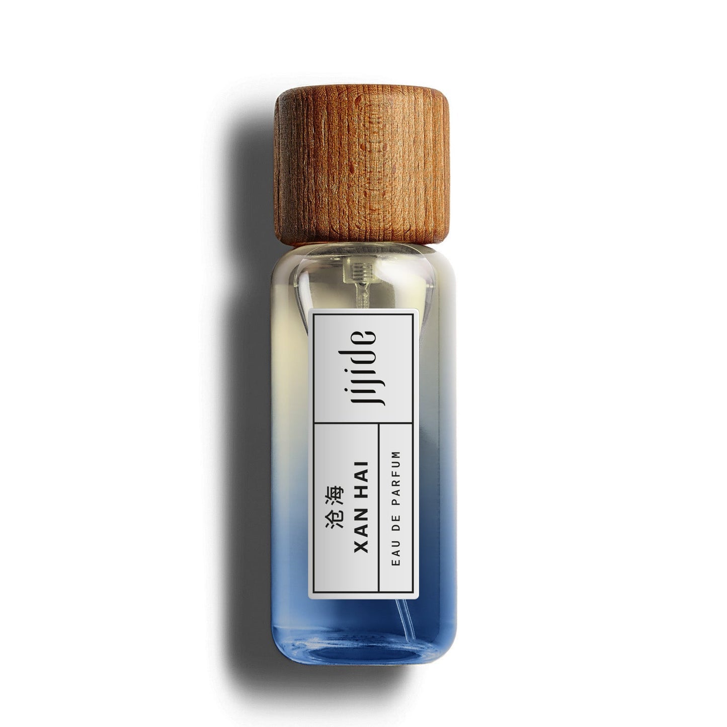 Small glass bottle with wooden cap on a white background