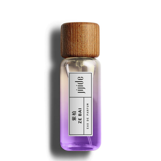 Perfume bottle with wooden cap on a white background