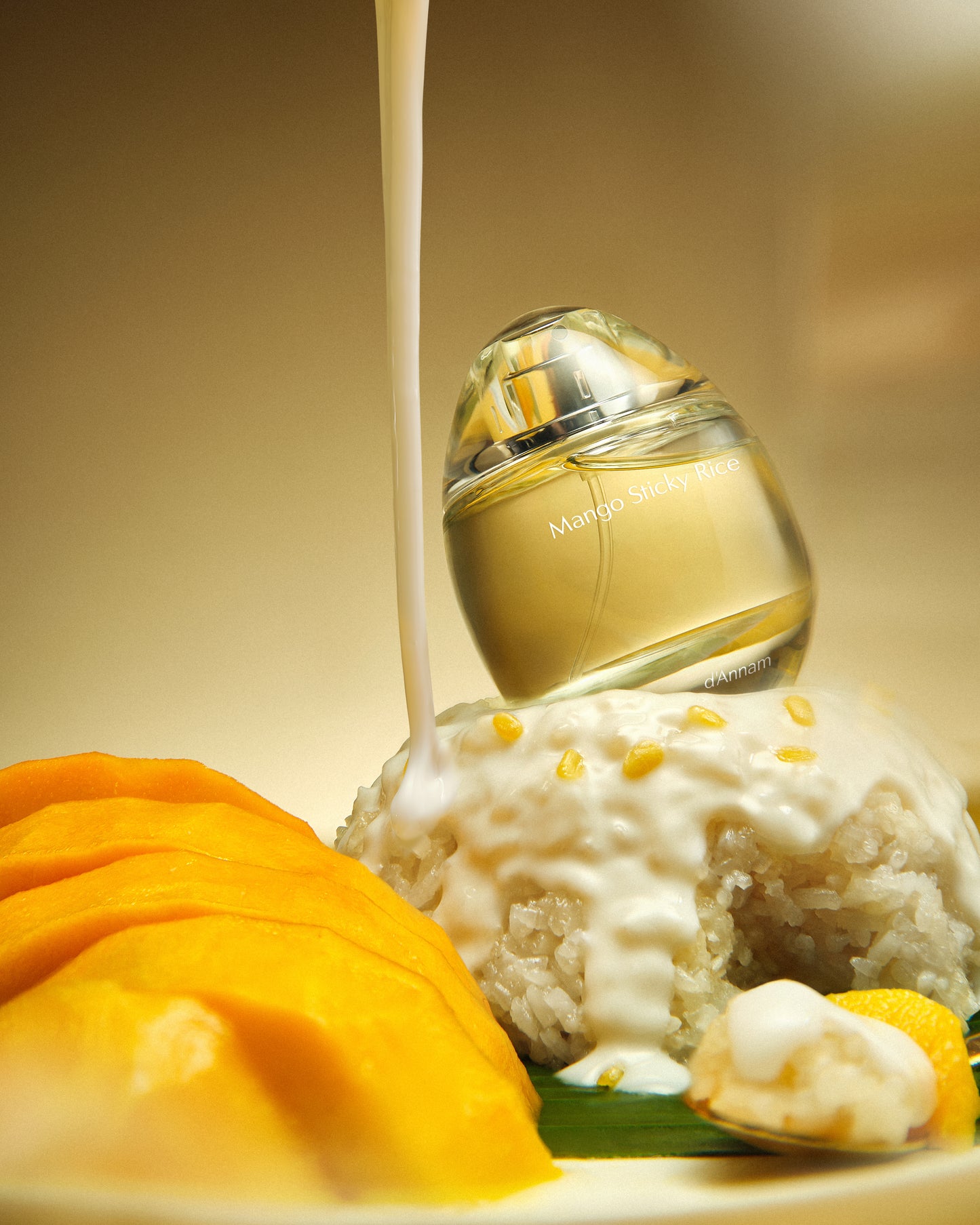 Perfume bottle with a scoop of ice cream and mangoes on a beige background