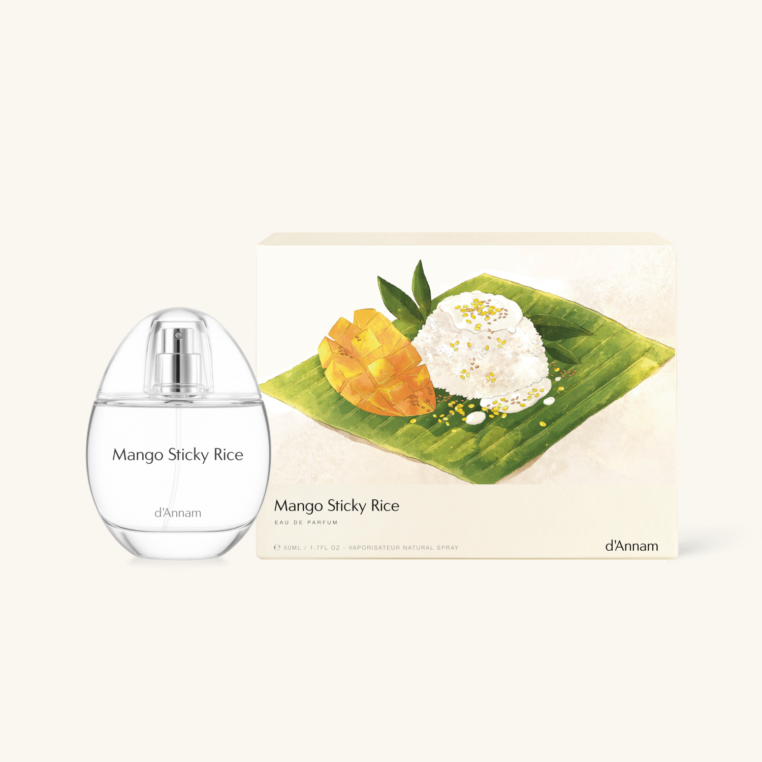 d'Annam Mango Sticky Rice Eau de Toilette spray bottle next to its illustrated packaging box, featuring a mango and sticky rice design on a banana leaf.
