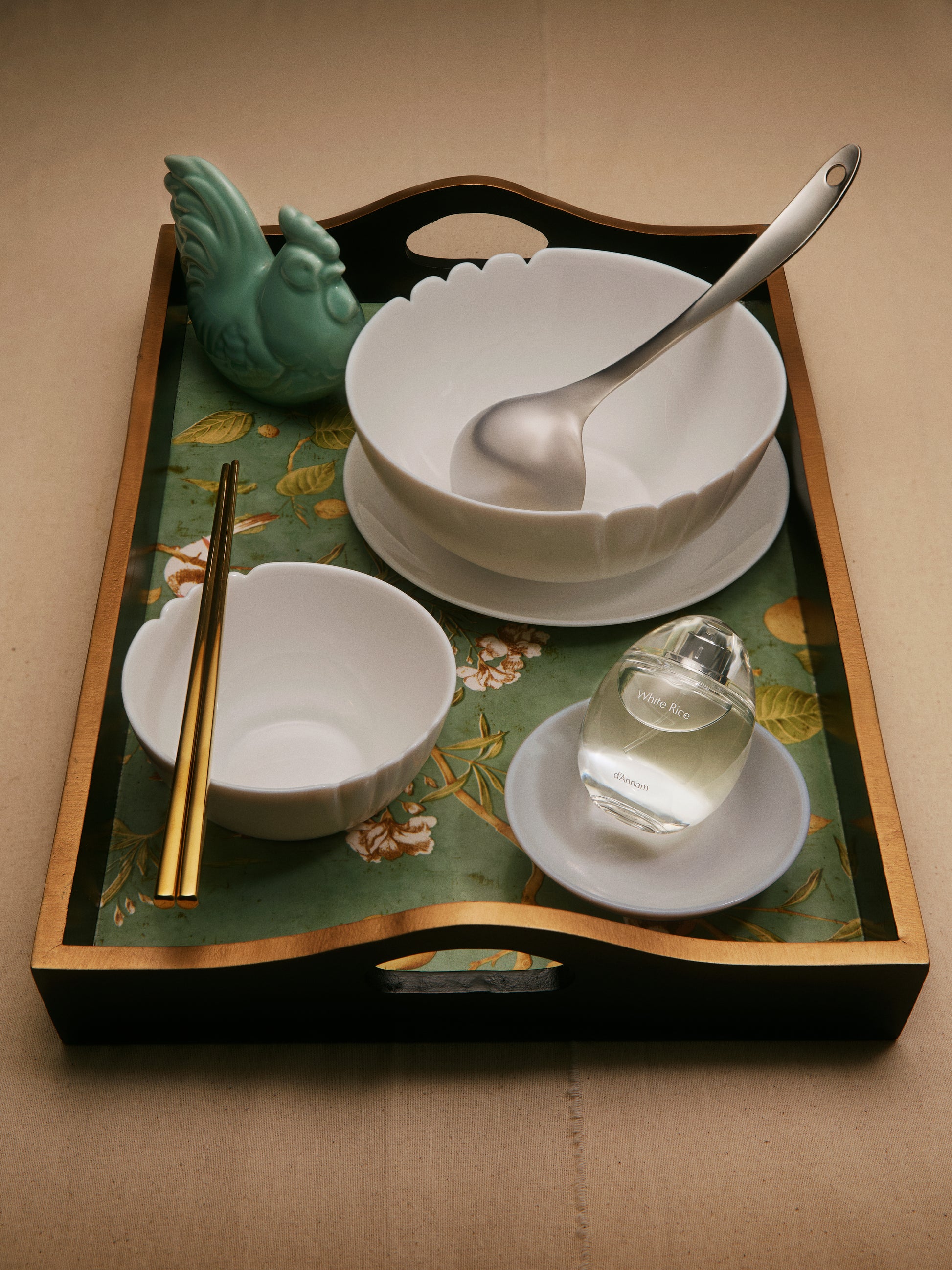 Tray with bowls, chopsticks, and a spoon on a decorative tray