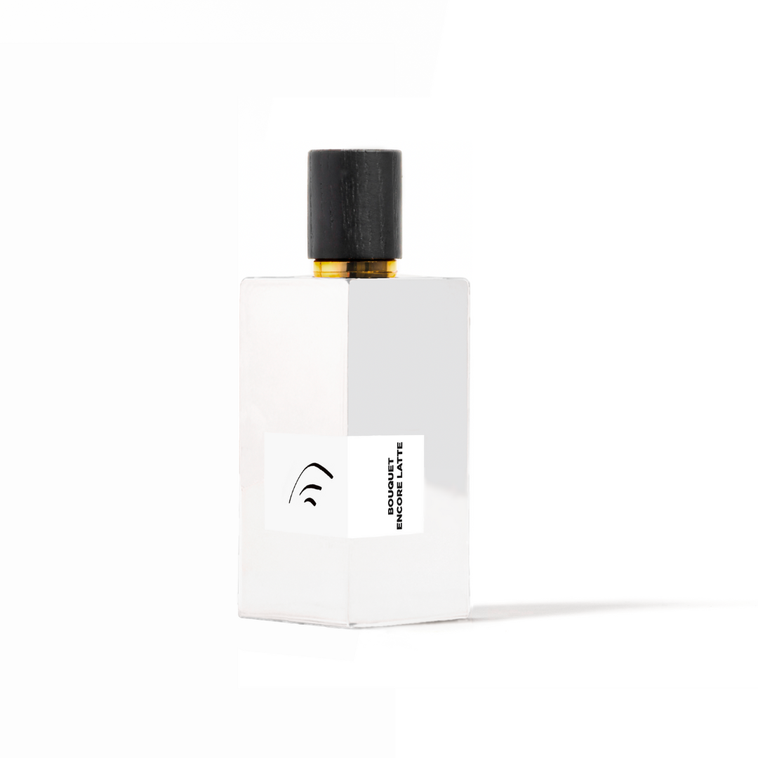 White perfume bottle with black cap on a white background