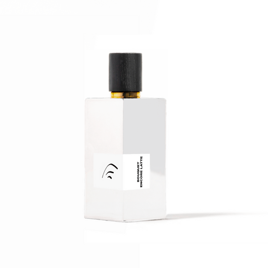 White perfume bottle with black cap on a white background